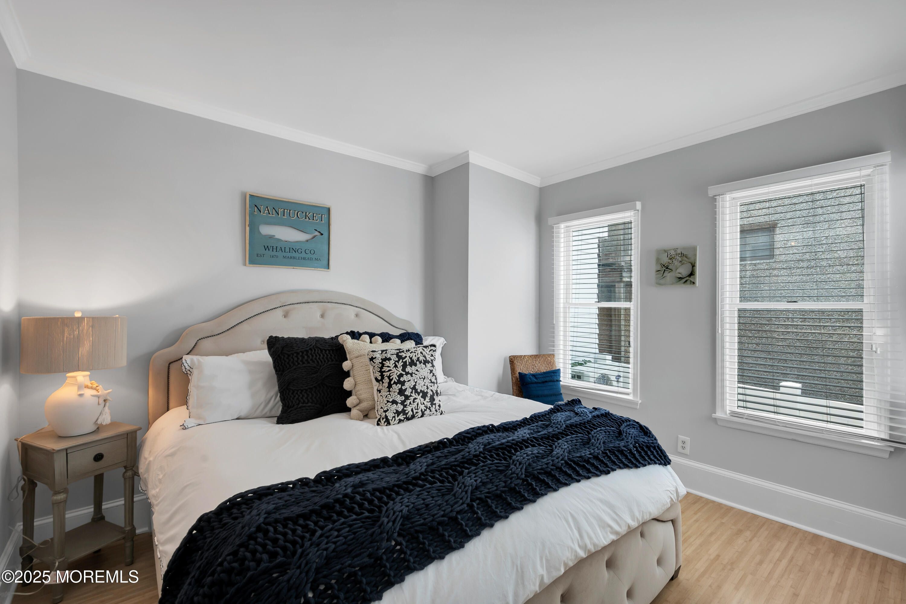 512 Main Avenue, Unit 4 Point Pleasant Beach, NJ 08742 - Photo 1 of 38 a bedroom with a large bed and a window