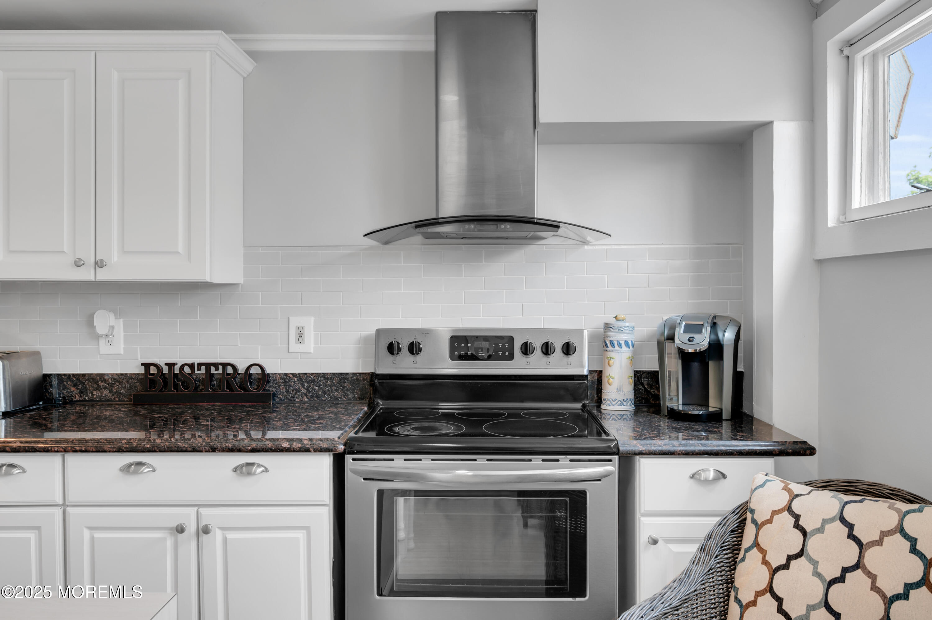 512 Main Avenue, Unit 4 Point Pleasant Beach, NJ 08742 - Photo 13 of 38 a kitchen with white cabinets and appliances