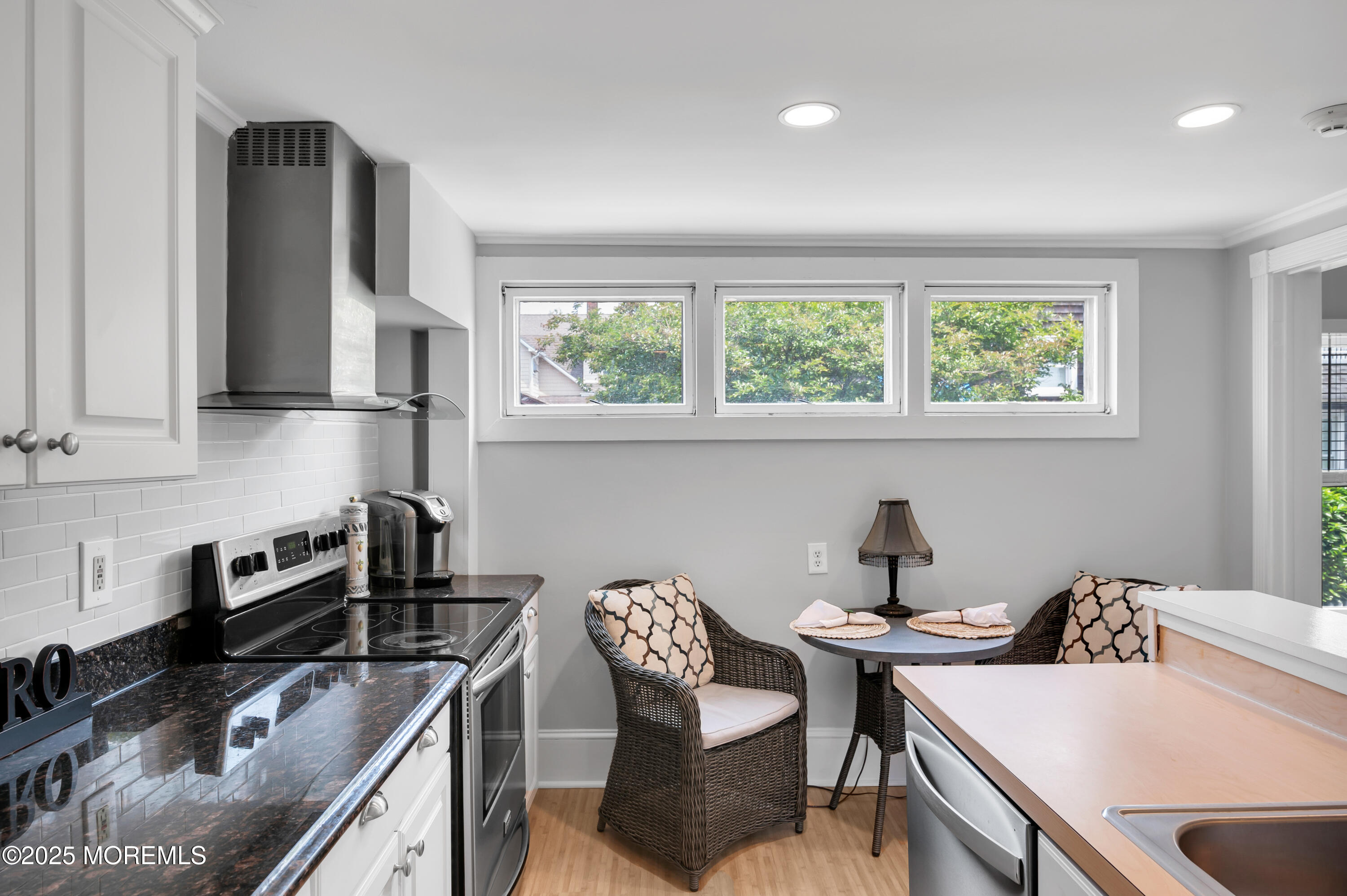 512 Main Avenue, Unit 4 Point Pleasant Beach, NJ 08742 - Photo 14 of 38 a kitchen that has a sink a window and chairs