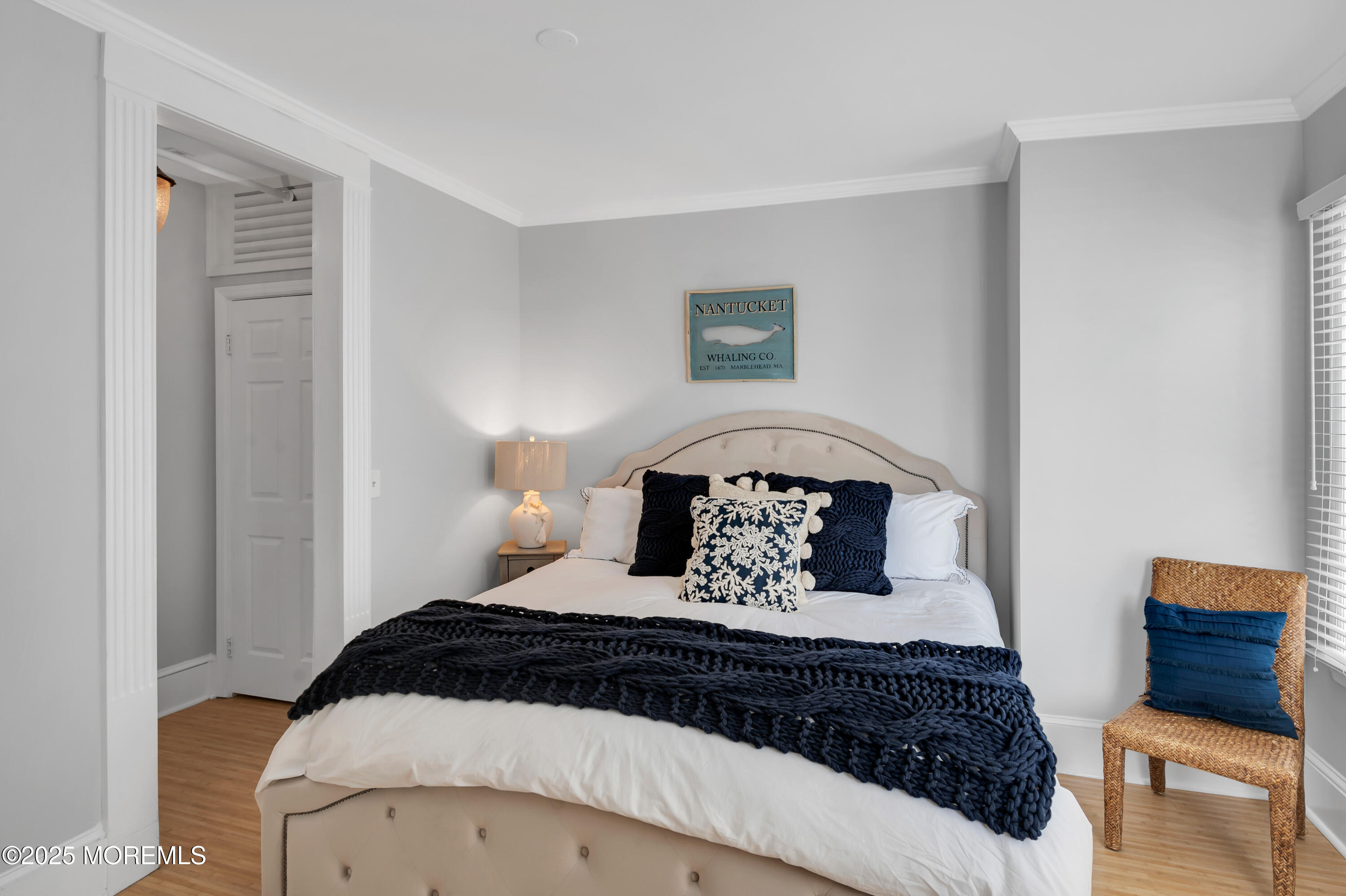 512 Main Avenue, Unit 4 Point Pleasant Beach, NJ 08742 - Photo 2 of 38 a bedroom with a bed and a mirror