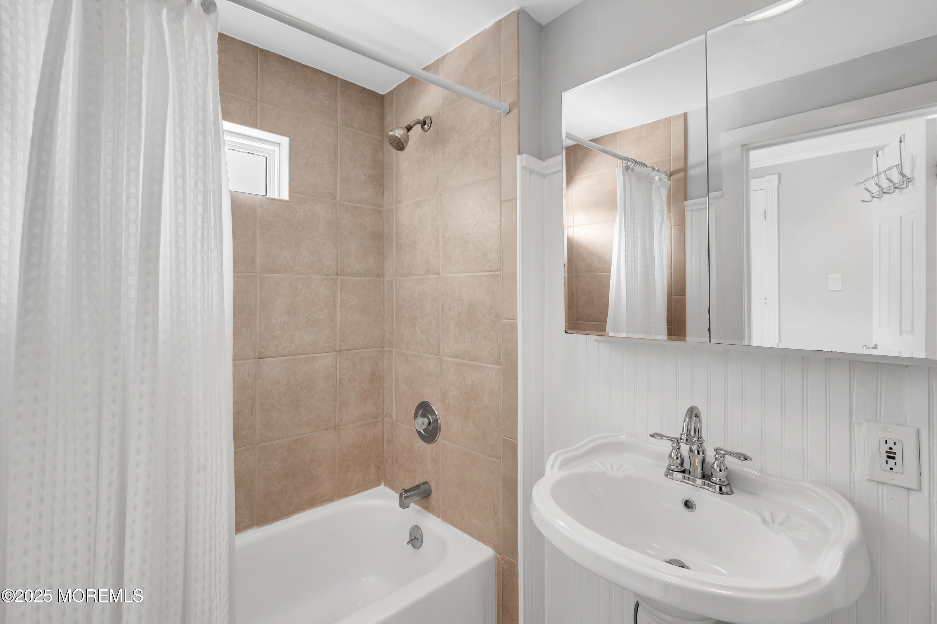 512 Main Avenue, Unit 4 Point Pleasant Beach, NJ 08742 - Photo 8 of 38 a bathroom with a sink a shower and a mirror