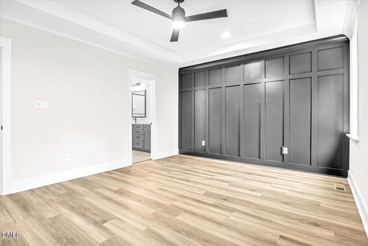 12916 Mallard Rock Road Zebulon, NC 27597 - Photo 17 of 68 a view of an empty room with wooden floor
