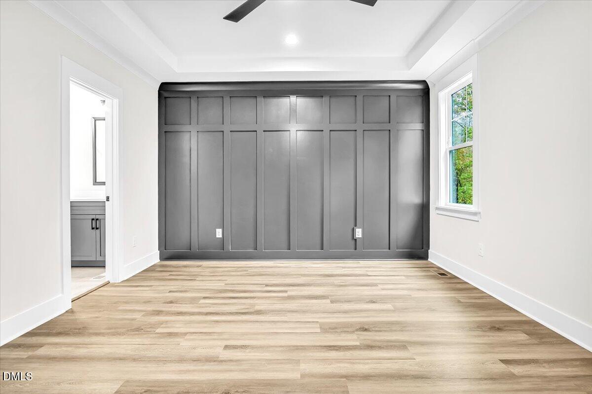 12916 Mallard Rock Road Zebulon, NC 27597 - Photo 18 of 68 a view of an empty room with wooden floor