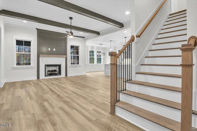 a view of entryway and hall with wooden floor
