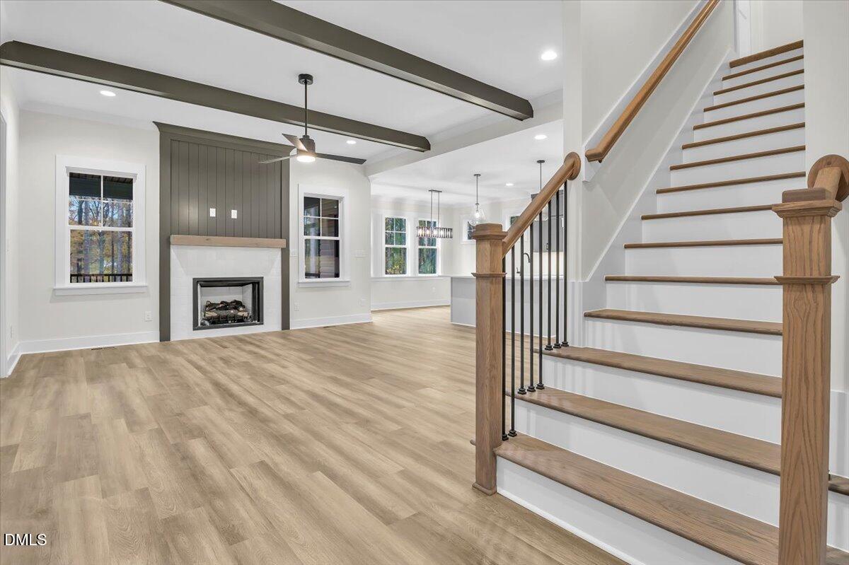 12916 Mallard Rock Road Zebulon, NC 27597 - Photo 3 of 68 a view of entryway and hall with wooden floor