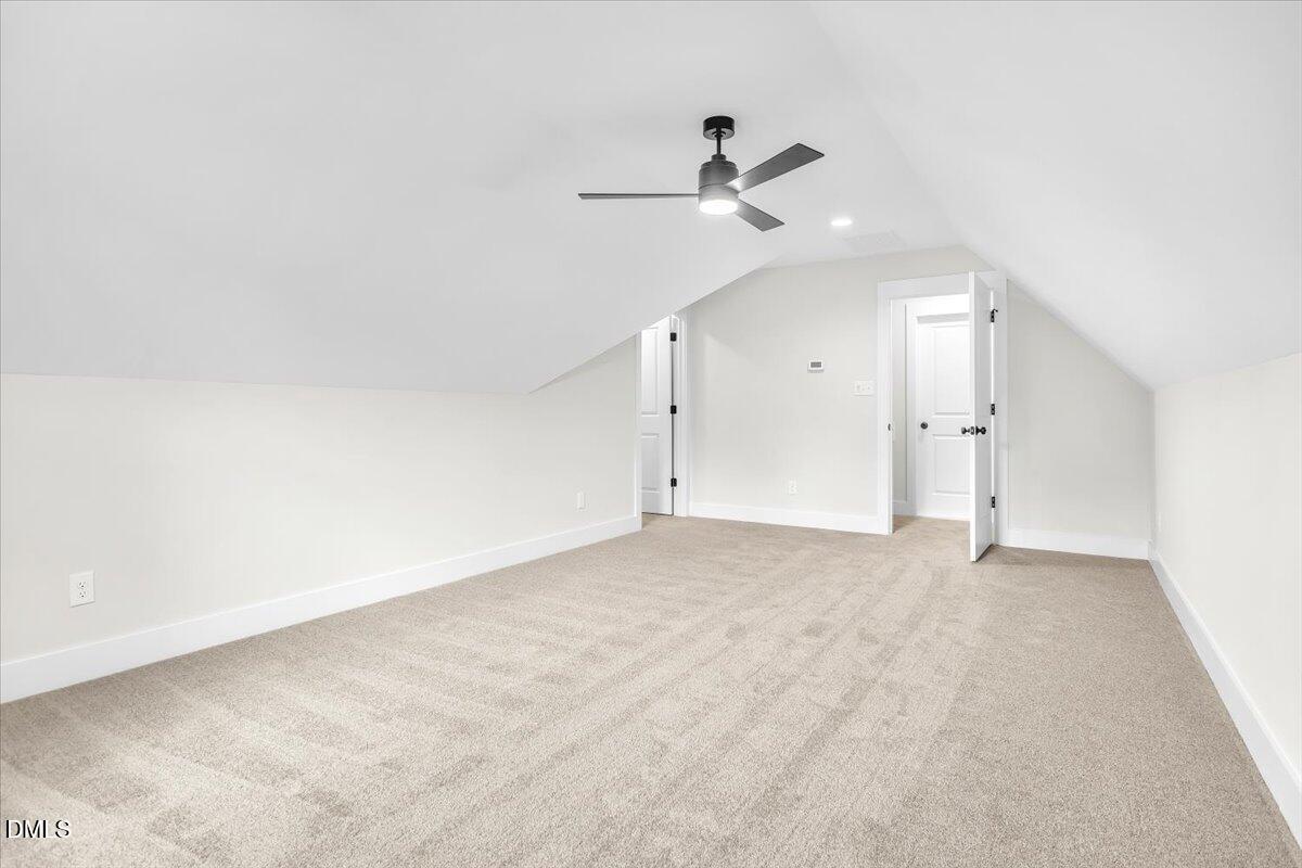 12916 Mallard Rock Road Zebulon, NC 27597 - Photo 33 of 68 an empty room with a ceiling fan and window