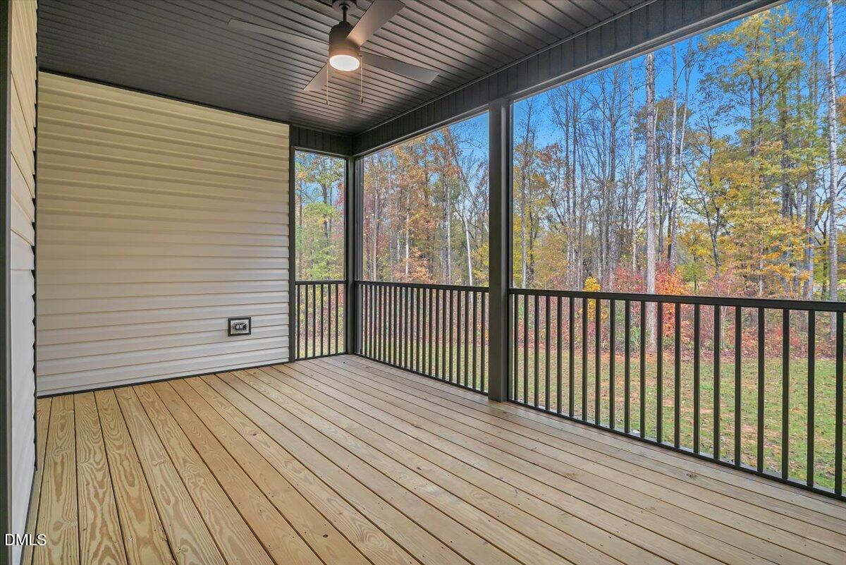 12916 Mallard Rock Road Zebulon, NC 27597 - Photo 40 of 68 a view of a balcony with wooden floor