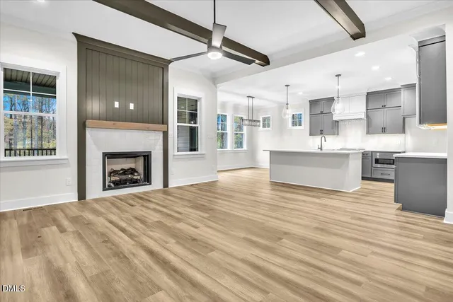 a view of kitchen with sink and wooden floor