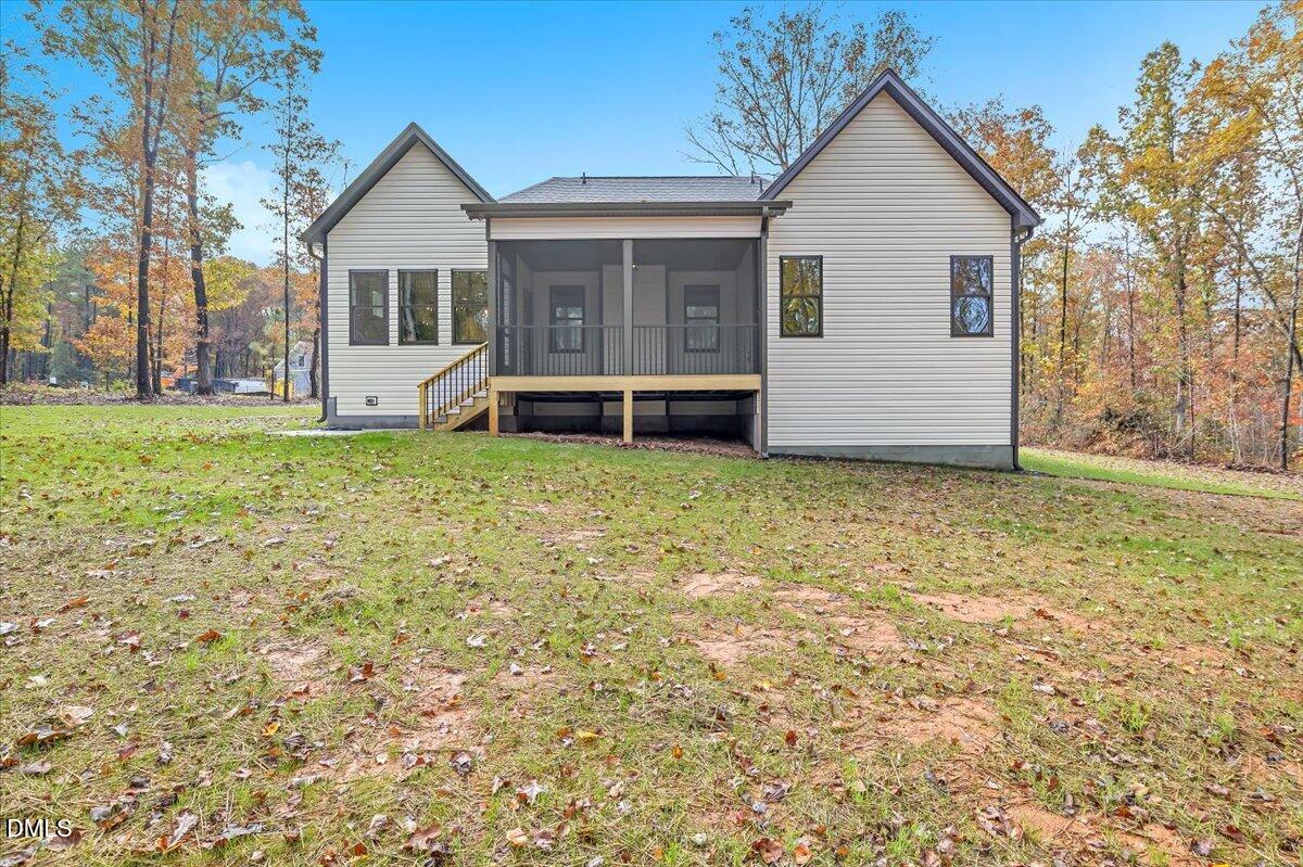 12916 Mallard Rock Road Zebulon, NC 27597 - Photo 43 of 68 a view of a house with a yard