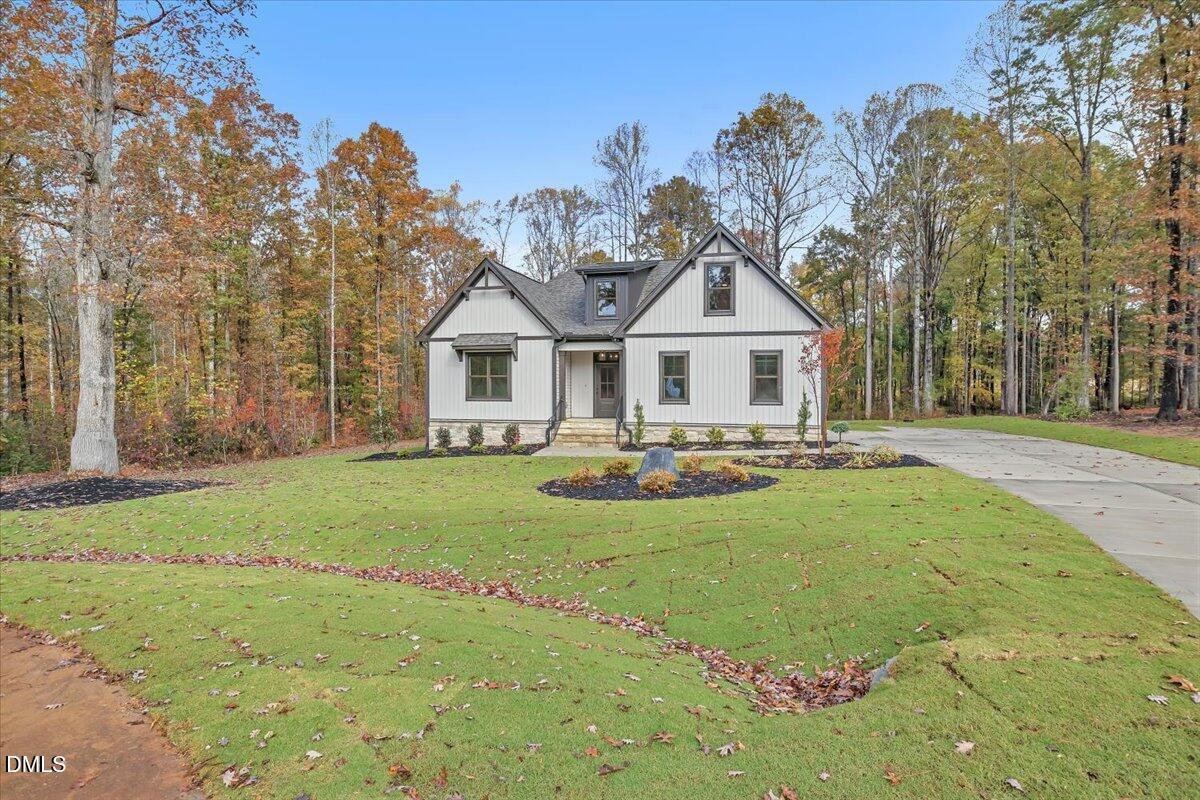 12916 Mallard Rock Road Zebulon, NC 27597 - Photo 50 of 68 a front view of a house with a yard