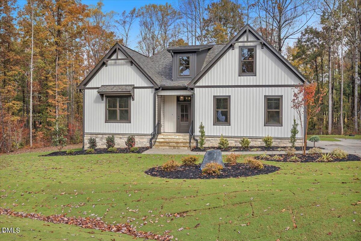12916 Mallard Rock Road Zebulon, NC 27597 - Photo 51 of 68 a front view of a house with a yard