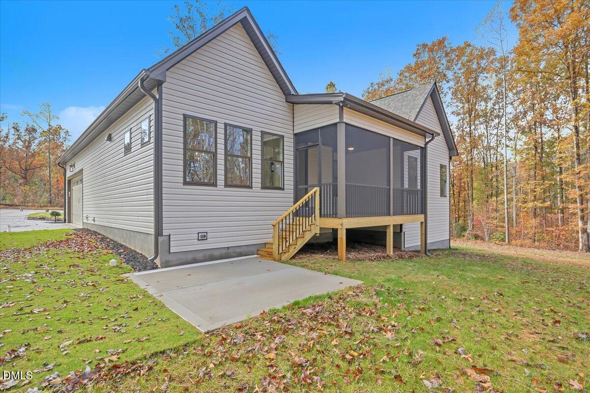 12916 Mallard Rock Road Zebulon, NC 27597 - Photo 55 of 68 a view of a house with a yard and sitting area