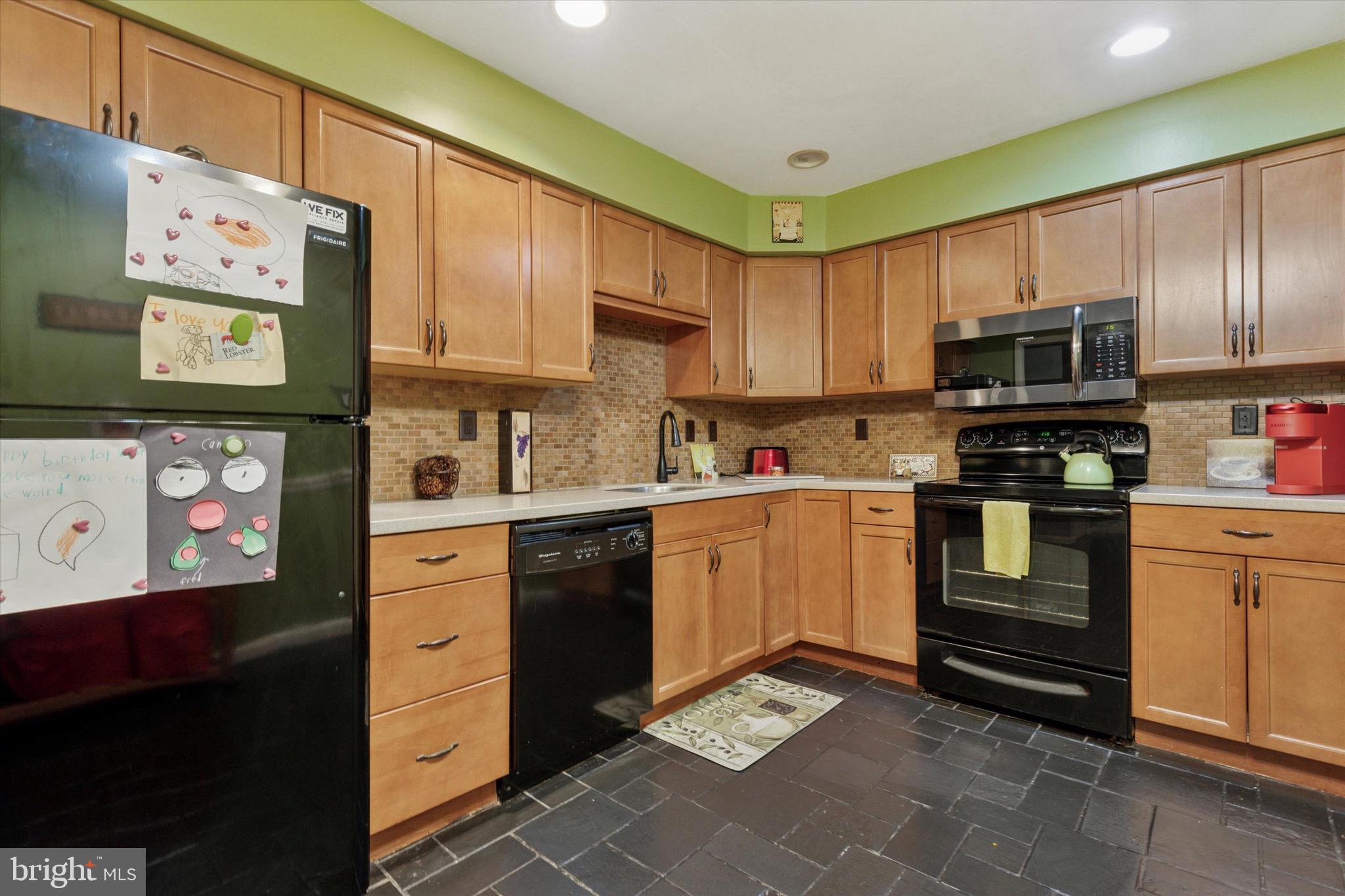 96 Providence Forge Road Royersford, PA 19468 - Photo 11 of 22 a kitchen with granite countertop a refrigerator stove and microwave