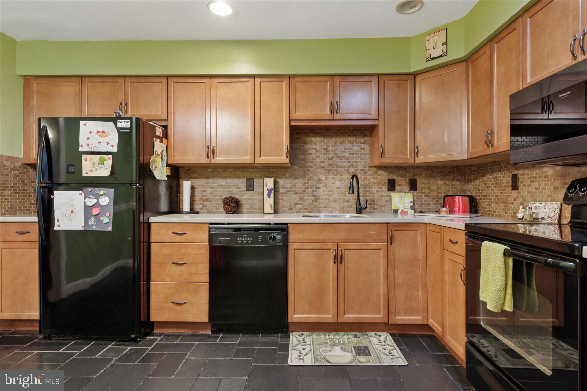 96 Providence Forge Road Royersford, PA 19468 - Photo 10 of 22 a kitchen with stainless steel appliances granite countertop a refrigerator stove and sink
