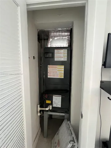 a living room with a fireplace and a flat screen tv