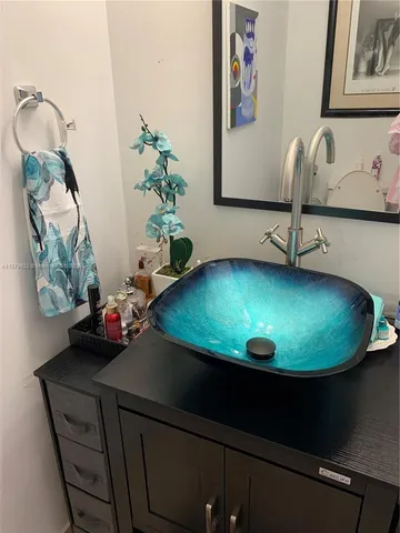 a view of a vase with flowers on a table