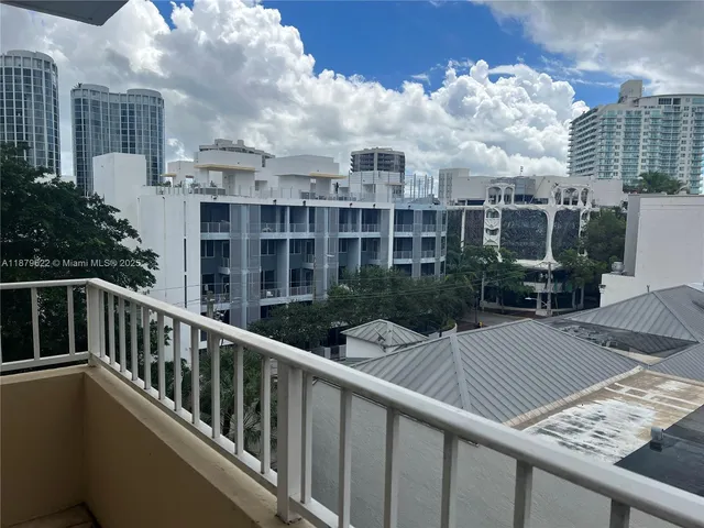 a view of a balcony with city view
