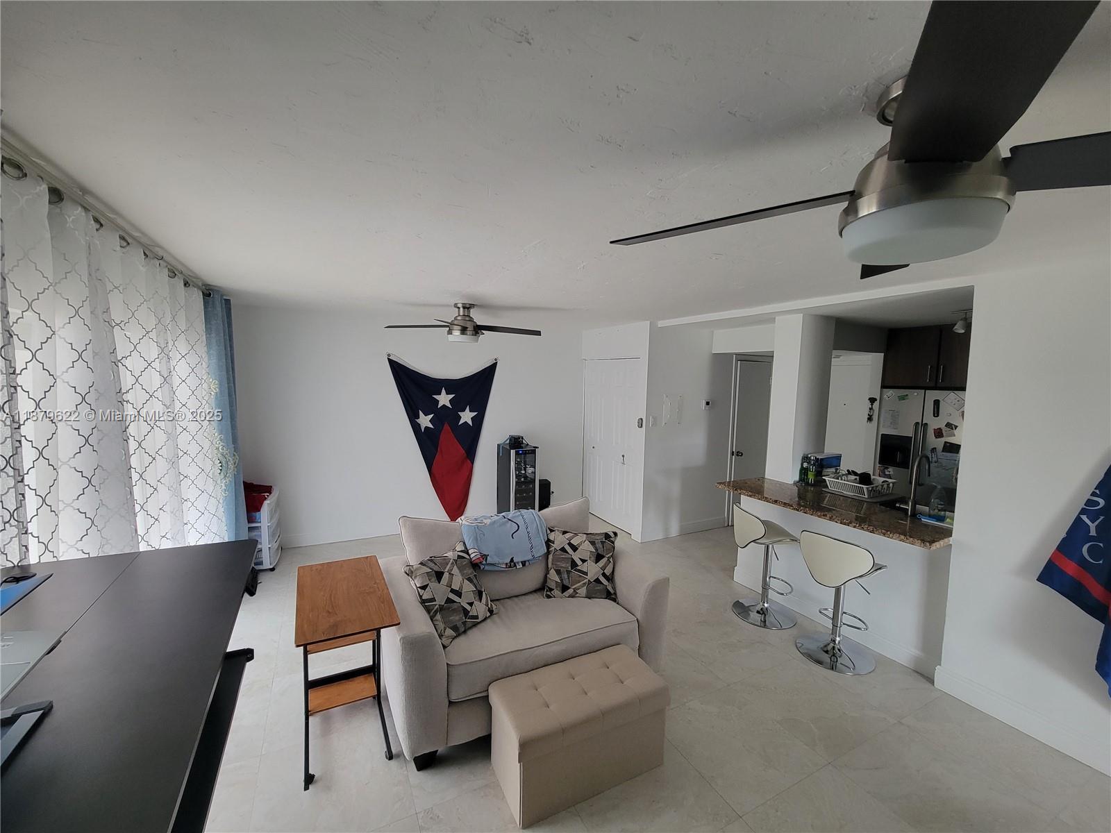 3304 Virginia Street, Unit 6C Miami, FL 33133 - Photo 2 of 22 a living room with furniture a rug and a window