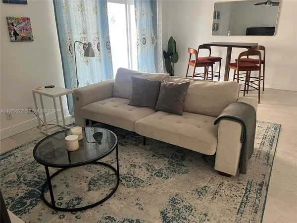 a living room with furniture and a table