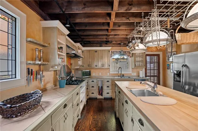 a kitchen that has a sink and a stove
