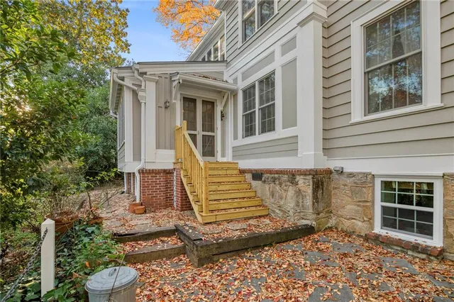 a view of a brick house with a large window