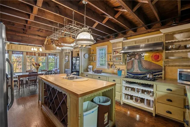 a view of a kitchen with appliances and cabinets