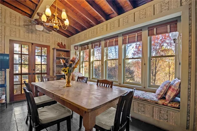 a view of a dining room with furniture window and outside view