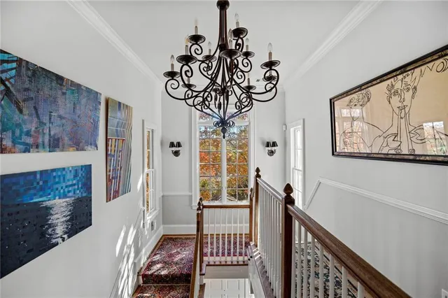 a view of entryway with a window and wooden floor
