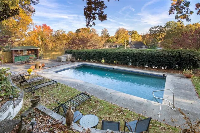 a view of a patio with chair and tables