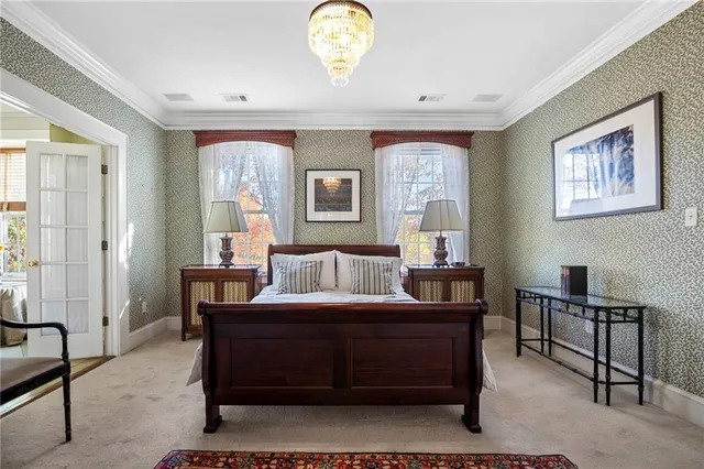 a bedroom with furniture and a window