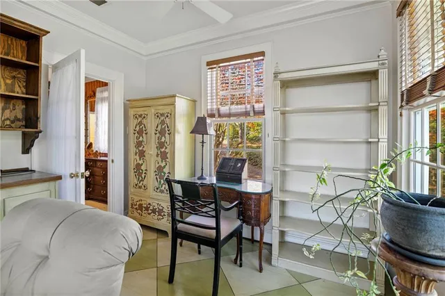 a living room with furniture a chandelier and a fireplace