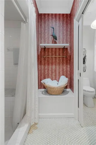 a view of a livingroom with furniture and hardwood floor