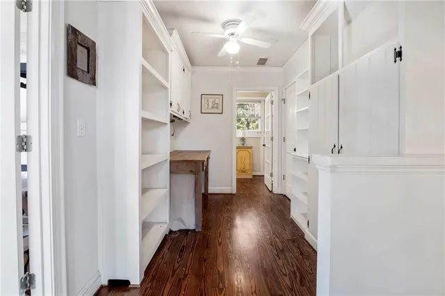 a bathroom with a granite countertop sink and a toilet