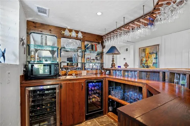 a view of a dinning room with a table and chairs