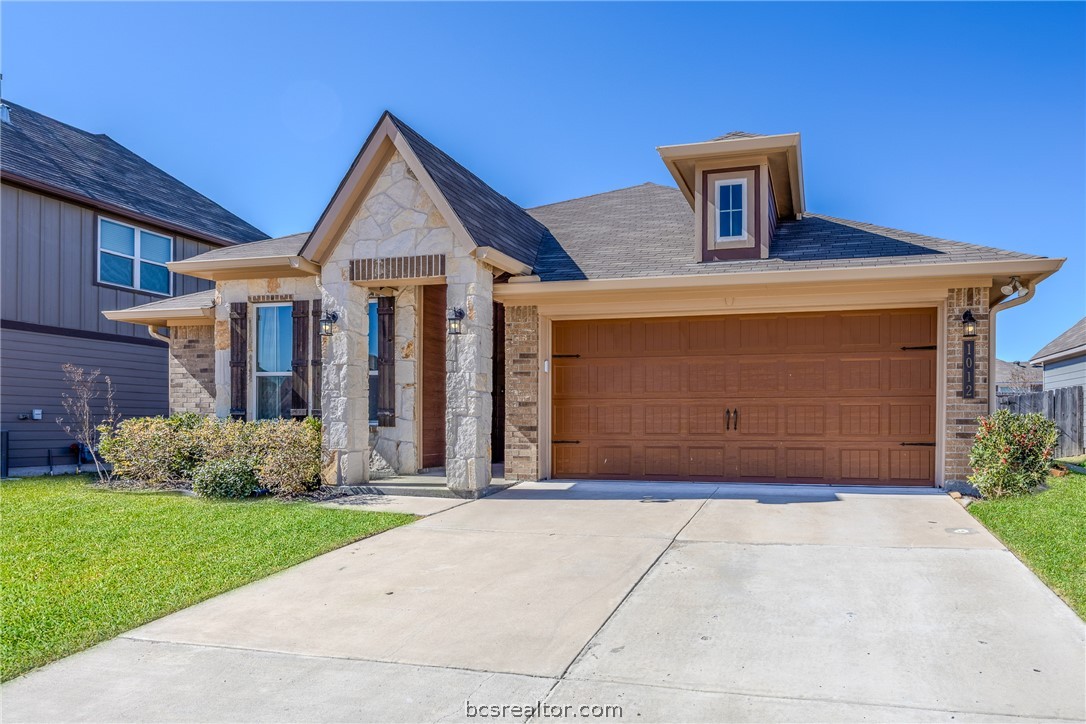 1012 Old Vine Road Brenham, TX 77833 - Photo 5 of 22 a front view of a house with garden