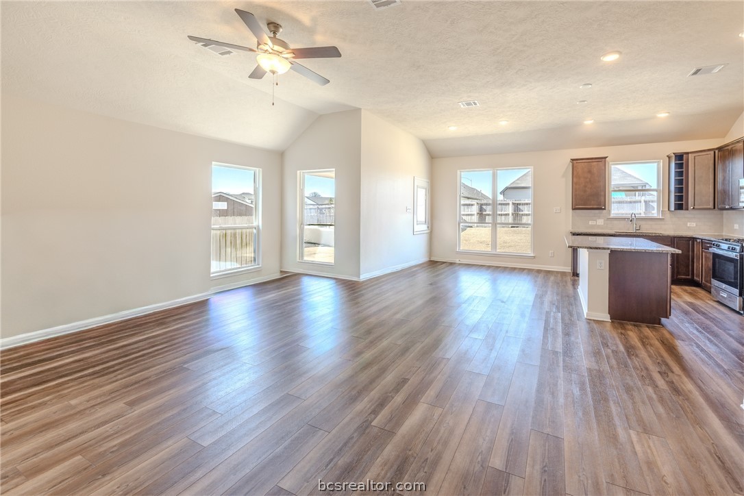 1012 Old Vine Road Brenham, TX 77833 - Photo 6 of 22 a view of an empty room with window and wooden floor