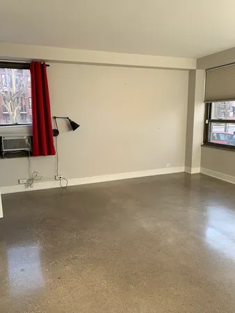 a view of a room with window and mirror
