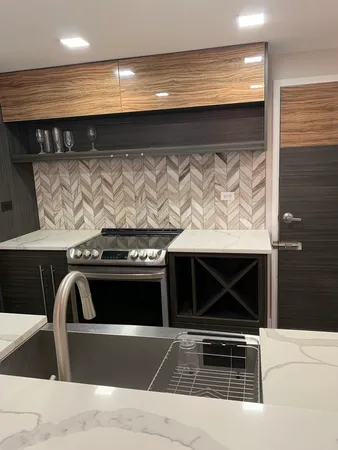 a stove top oven sitting inside of a kitchen