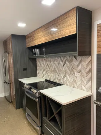 a kitchen that has a stove and a microwave