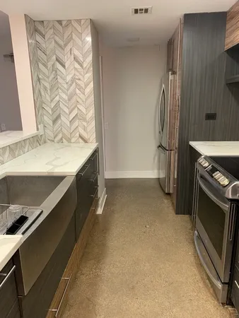 a kitchen with stainless steel appliances a stove and a refrigerator