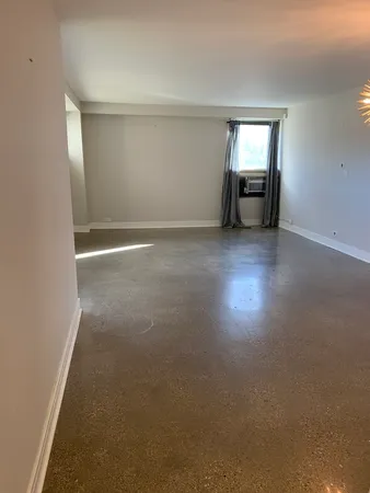 an empty room with windows and view