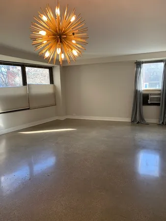 a view of an empty room and window