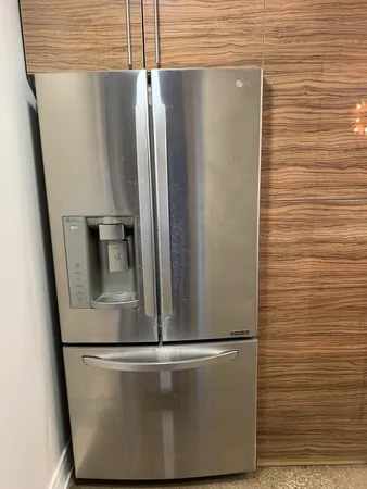 a view of a refrigerator in kitchen