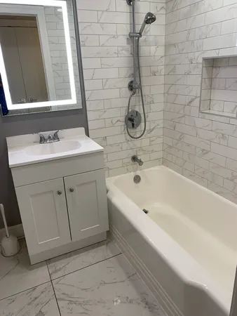 a bathroom with a sink and a bathtub