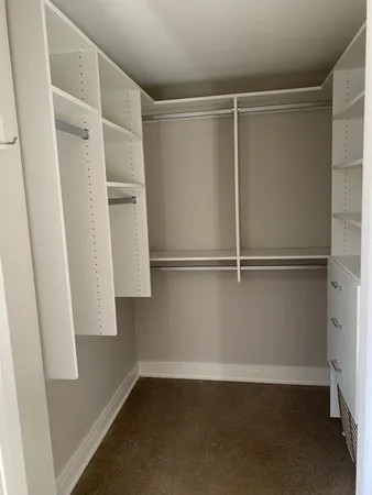 a view of an empty walk in closet