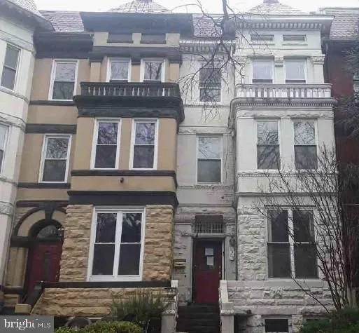 a building with a window and balcony