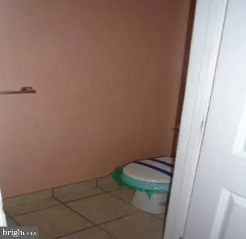 a bathroom with a small window