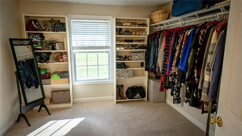 669 Unionville Road Butler, PA 16001 - Photo 14 of 21 a view of walk in closet with clothes and shoes
