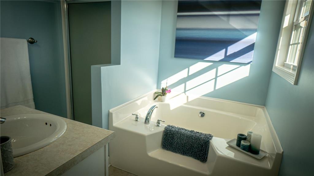 669 Unionville Road Butler, PA 16001 - Photo 15 of 21 a bathroom with a sink and mirror