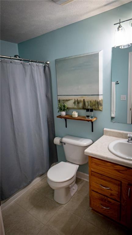 669 Unionville Road Butler, PA 16001 - Photo 17 of 21 a bathroom with a sink a toilet a mirror and vanity